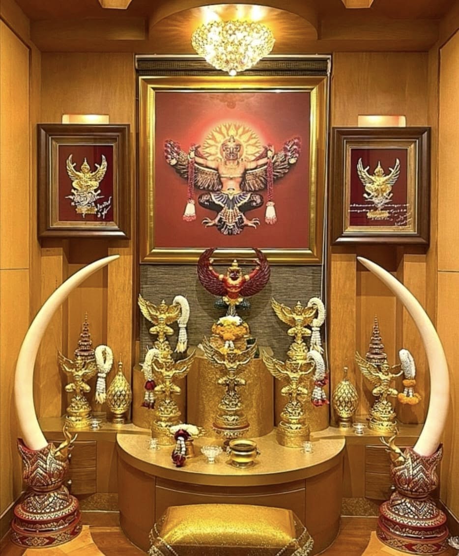 Temple interior with chandeliers — gold Buddha altar