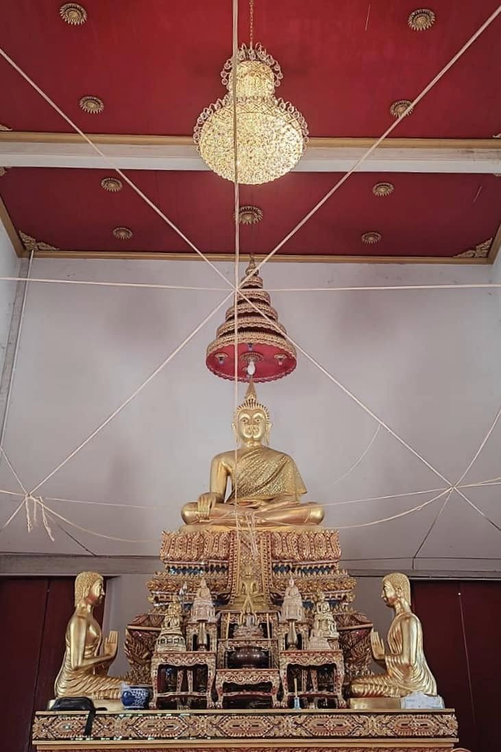 Ornate gold temple interior with lighting accents