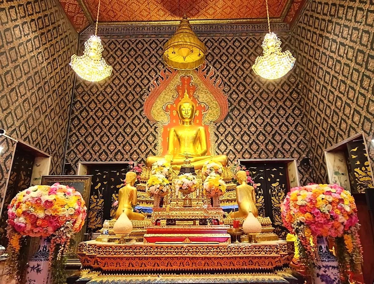 Large Buddha hall with hanging crystal chandeliers